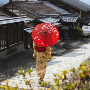 women in kimono with umbrella